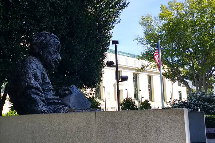 A view of the Albert Einstein Memorial Statue with the National Academy of Sciences (NAS) Building in the background (photo courtesy of NAS)