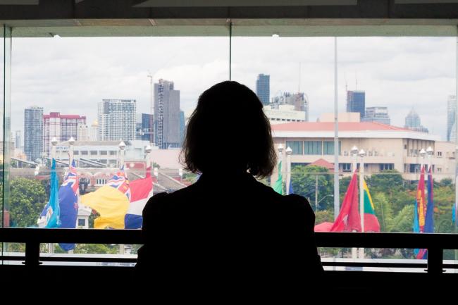 A delegate takes in the view outside the plenary hall