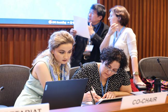 Co-Chairs and Secretariat prepare for the discussion_OEWG1.2_2feb2023_photo.jpg