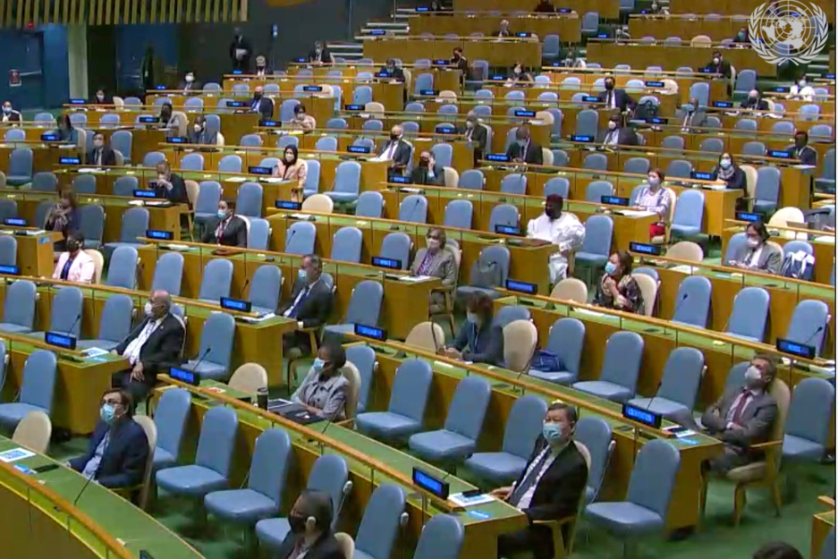 Delegates socially distance within the UNGA Hall.