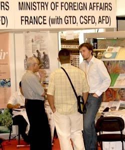 Delegates and participants visiting various information stands.