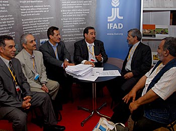 Delegates and participants at the IFAD information booth.