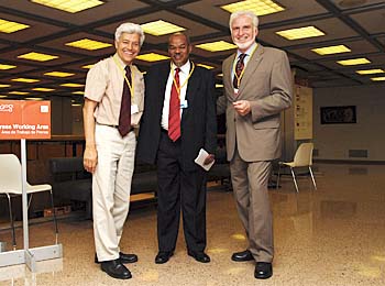 Uriel Safriel, Israel, left, and Michael Angstreich, Norway, right, welcome former UNCCD Executive Secretary Hama Arba Diallo, center, to COP 8.