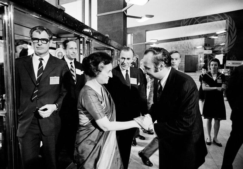 Indira Gandhi shakes hands with Maurice Strong