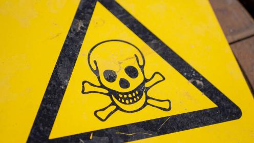 Black and yellow poison sign