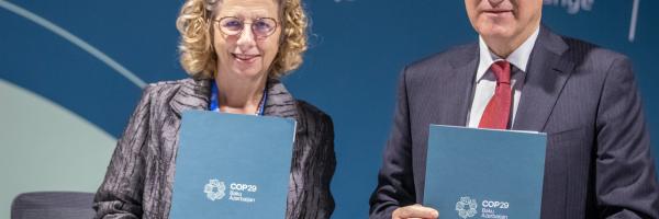 Inger Andersen, Executive Director, UN Environment Programme (UNEP) and Mukhtar Babayev, COP29 President, hold their signed Letters of Intent for the Baku Dialogue on Water for Climate Action 