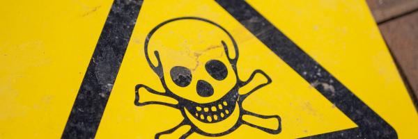 Black and yellow poison sign
