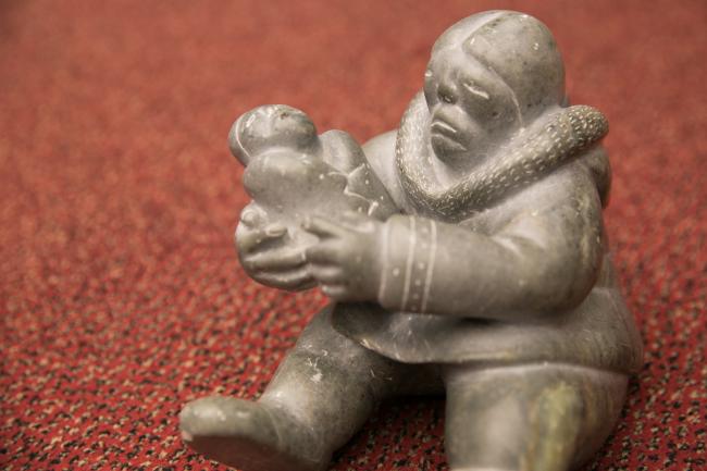 This Inuit carving of a mother and child, a gift of the Inuit Circumpolar Council to UNEP in 1999, is often displayed at Stockholm Convention meetings to remind participants of the significance of their work to protect human health and the environment. (photo from 2017 Conference of the Parties)