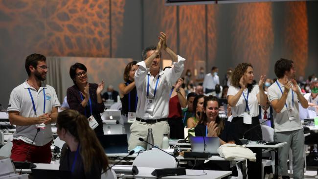 Participants celebrating the approval of motion A, regardging the inclusion of subnational governments in IUCN’s membership