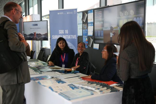 Delegates visit the exhibition stands around the venue