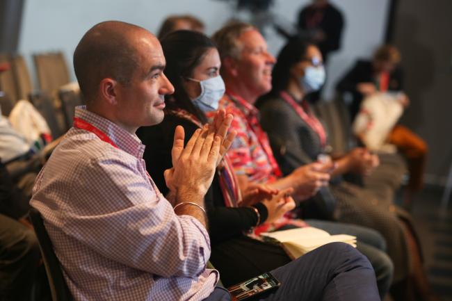 Participants applaud during the parallel sessions