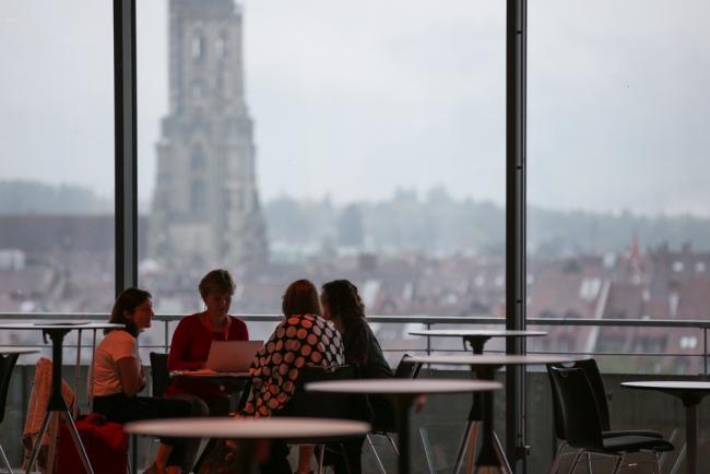 Delegates speak informally while enjoying the panoramic views of Bern