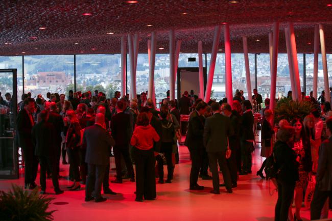 Delegates attend the opening reception