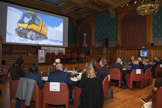 Participants watch a short film on Venturi Antarctica, the first electric polar exploration vehicle