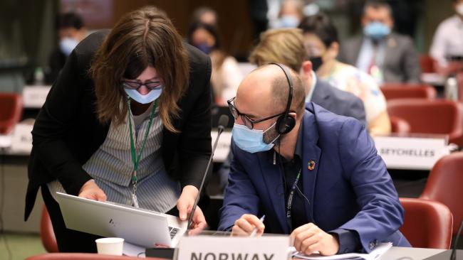 Delegates from Norway during a break in negotiations
