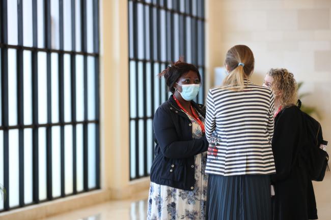 Delegates consult in the corridors