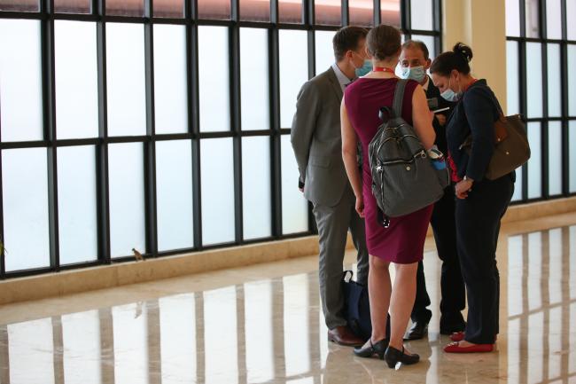 Delegates consult in the corridors