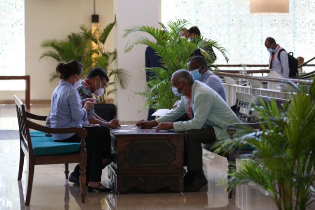 Delegates meet informally during the day