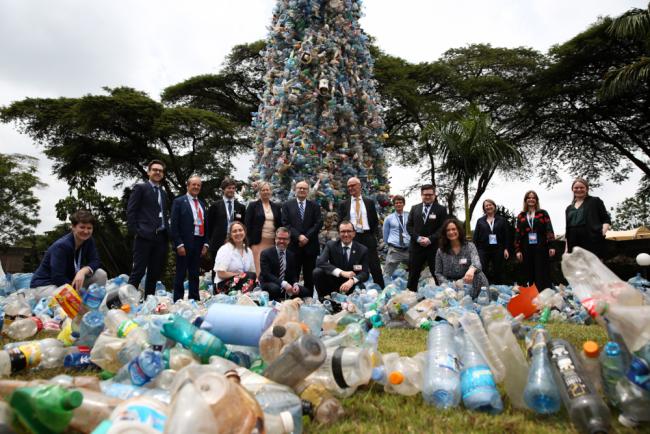 The Norwegian delegation beneath the Giant Tap of plastics