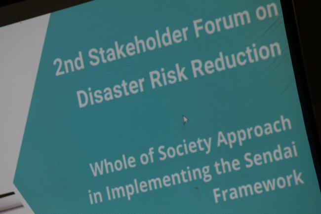 A session discusses a 'whole of society approach' in implementing the Sendai Framework