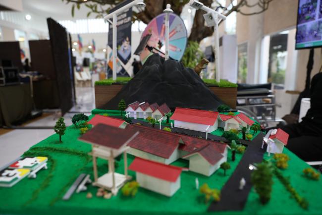 A model display of a community-led innovation partnership shows how emergency responses can be taken in communities vulnerable to volcanoes