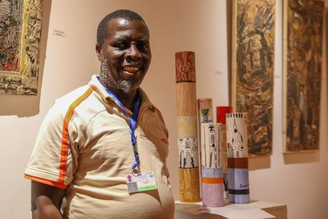 Yapaud, Côte d'Ivoire artist, displays his art around the venue