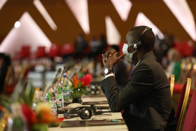 Delegates follow the proceedings