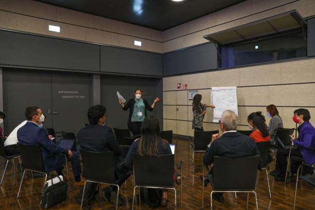 Delegates break out into groups to discuss how to frame the new finance goal