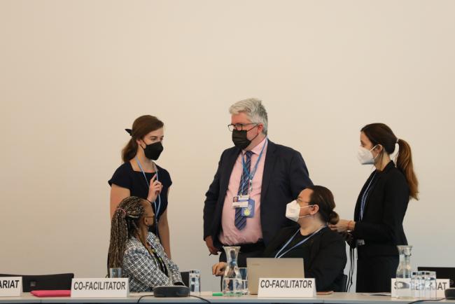 Co-facilitators and the UNFCCC Secretariat consult during the informal consultations on matters relating to the Glasgow work programme on ACE