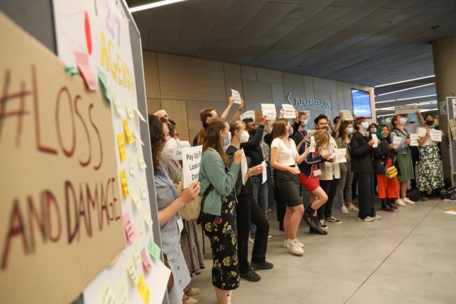 Members of civil society demonstrate in the corridors, calling for loss and damage to be put on the agenda, and for more climate finance