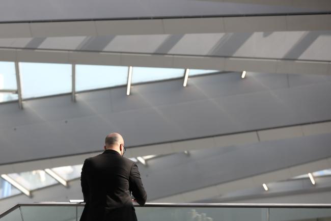 On the penultimate day of UNFCCC SB56, a delegate watches the proceedings around the venue