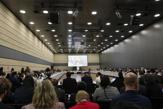 Delegates gather for the final negotiations before closing plenary