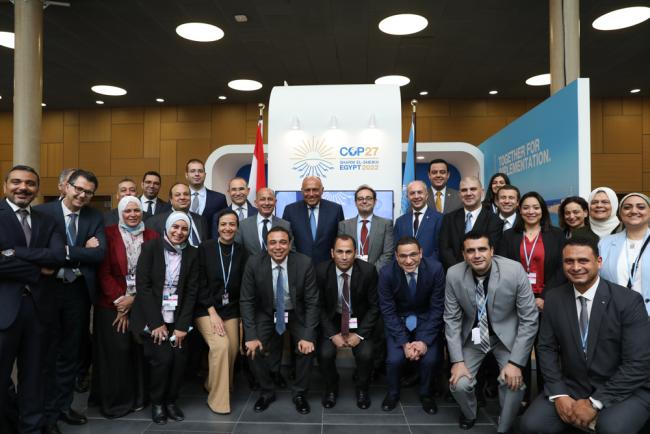 The Egyptian delegation gathers for the signing of the host country agreement ahead of COP 27