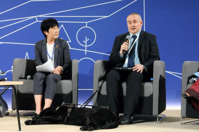 Naoko Yamamoto, Assistant Director-General for Universal Health Coverage and Health Systems, World Health Organization, and Paweł Wdówik, Ministry of Family and Social Policy, Poland