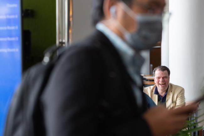 Delegate laughing over lunch - OEWG-44/ExMOP-5 - 15Jul2022 - Photo