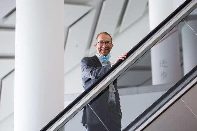 Delegate on escalator -OEWG-44/ExMOP-5 - 14Jul2022 - photo