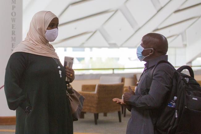 Delegates talking - OEWG-44-ExMOP-5 - 12Jul2022 - Photo-2.jpg