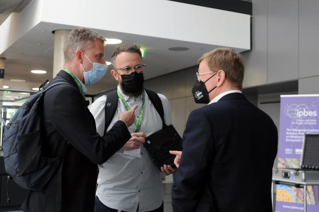 EU delegates confer during a break from the Working Group