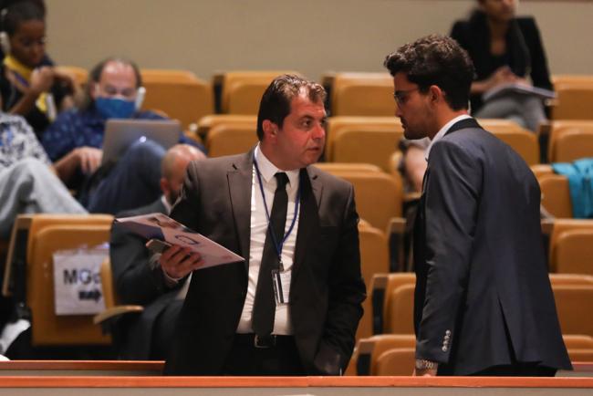 Delegates speak informally