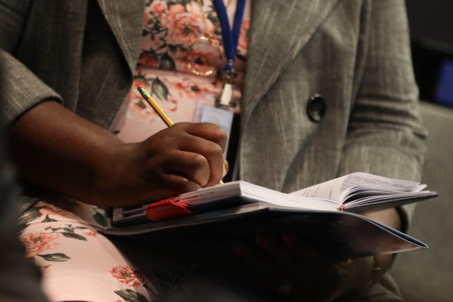 Delegate takes notes