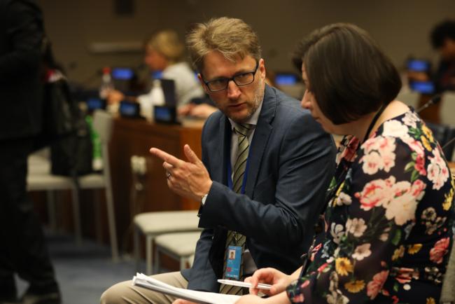 Delegates consult throughout the day