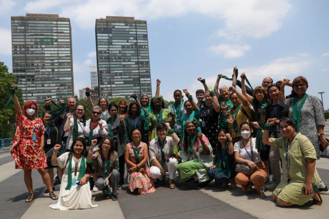 The Women's Major Group takes a family photo to celebrate their 30 years of activism within the UN