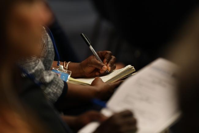 Delegate takes notes