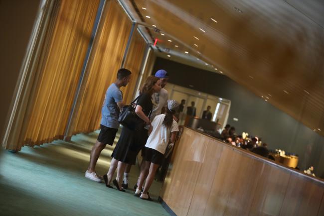 Visitors to the UN watch the proceedings in the UN General Assembly