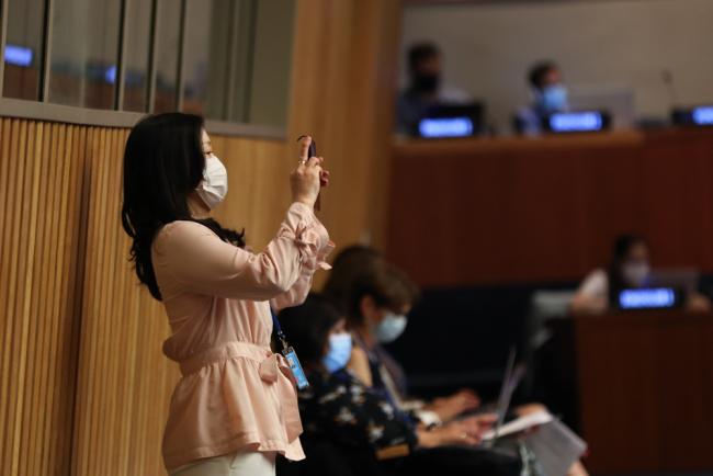 Delegates take photos throughout the day