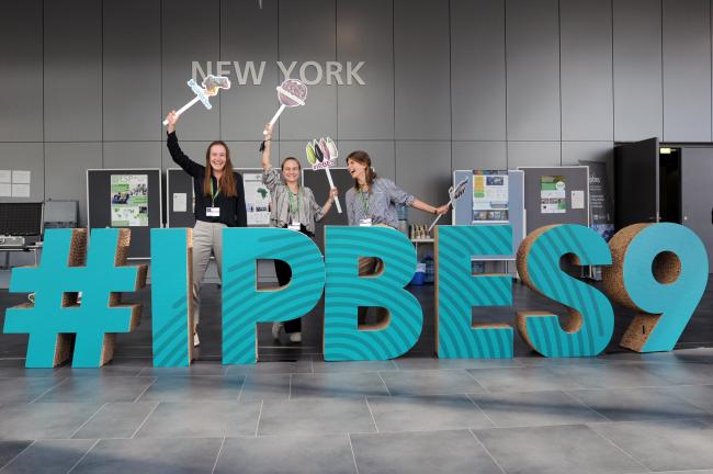 Participants at the IPBES9 sign