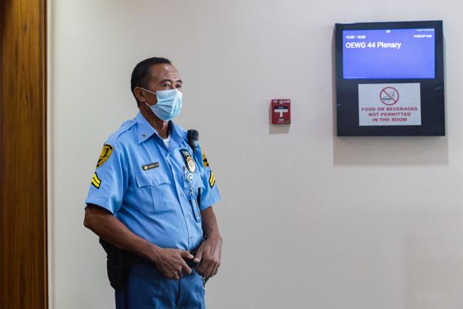 Security guard outside plenary - OEWG-44-ExMOP-5 - 11Jul2022 - Photo.jpg