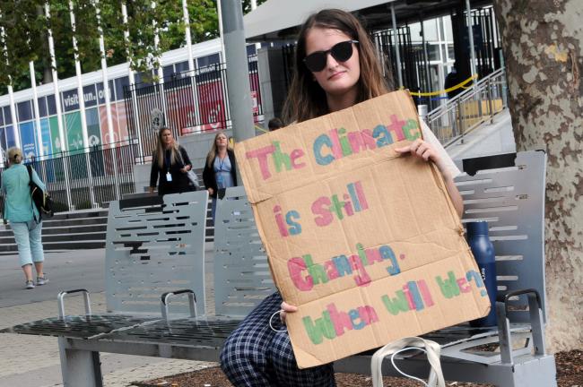 An activist outside UN headquarters