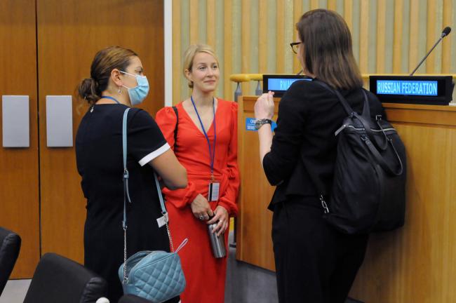 Delegates discuss before the morning session