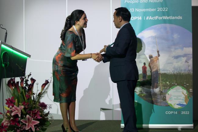 COP 14 Alternate President Wu Zhimin awards Carla Ximena Giraldo Malca, Municipal Authority to the Sustainability, Pantanos de Villa wetland, Peru  